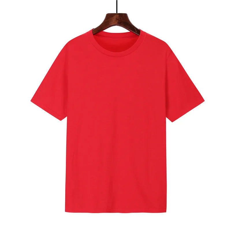 Man wearing a black loose-fit cotton T-shirt, short sleeves, crew neck.