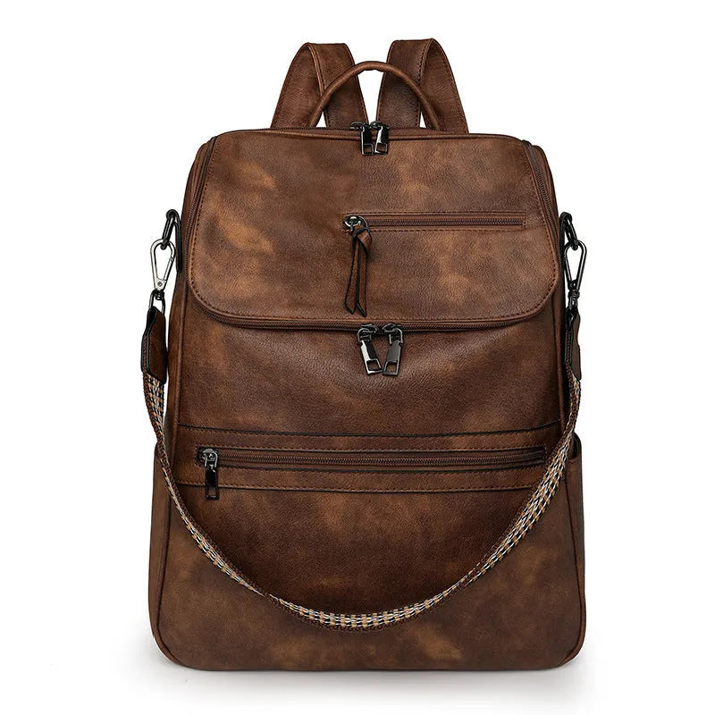 Retro college student backpack in PU leather with curved shoulder straps showing stitching detail