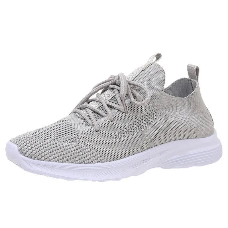 Women's mesh running shoes in Creamy White with Flyknit upper and low-top design