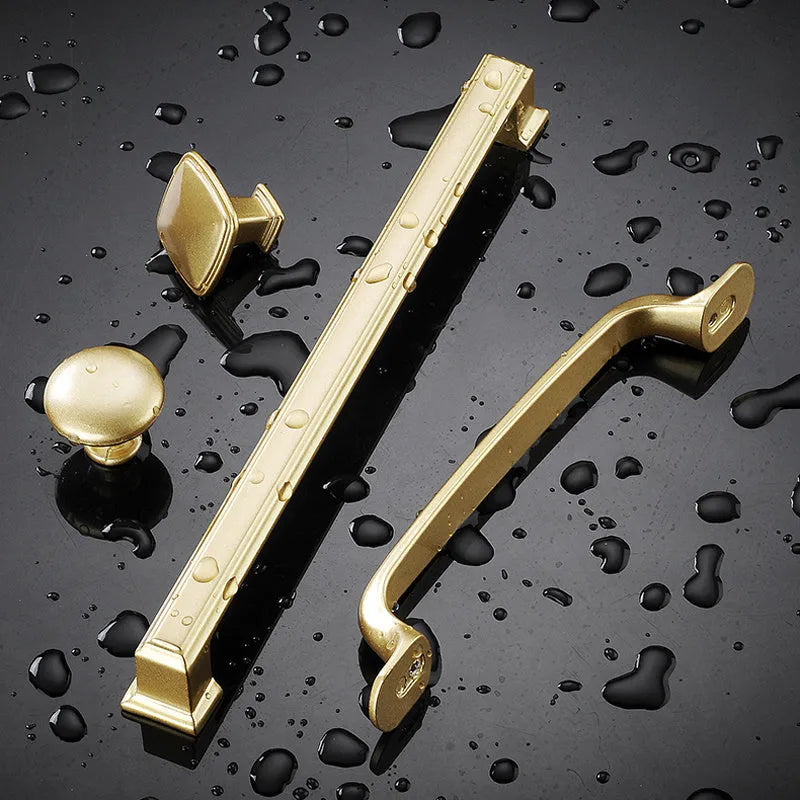 Gold T-shaped modern single hole cabinet drawer handle showing three size variants.