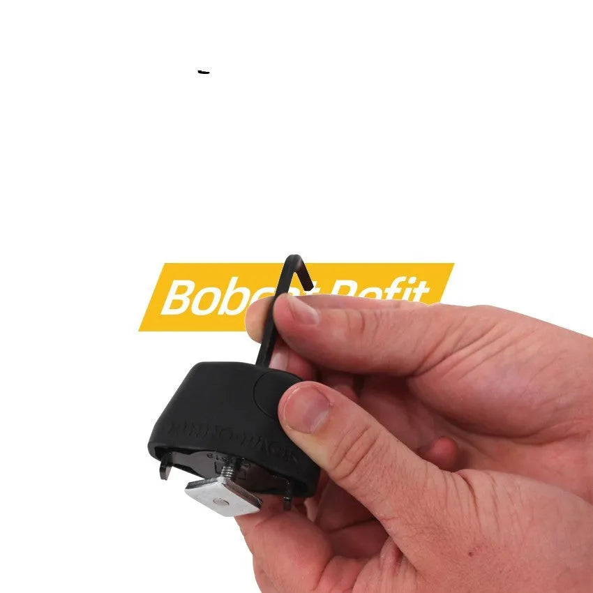 Plastic-sheathed steel cable lock for securing kayak to a vehicle roof rack without drilling.