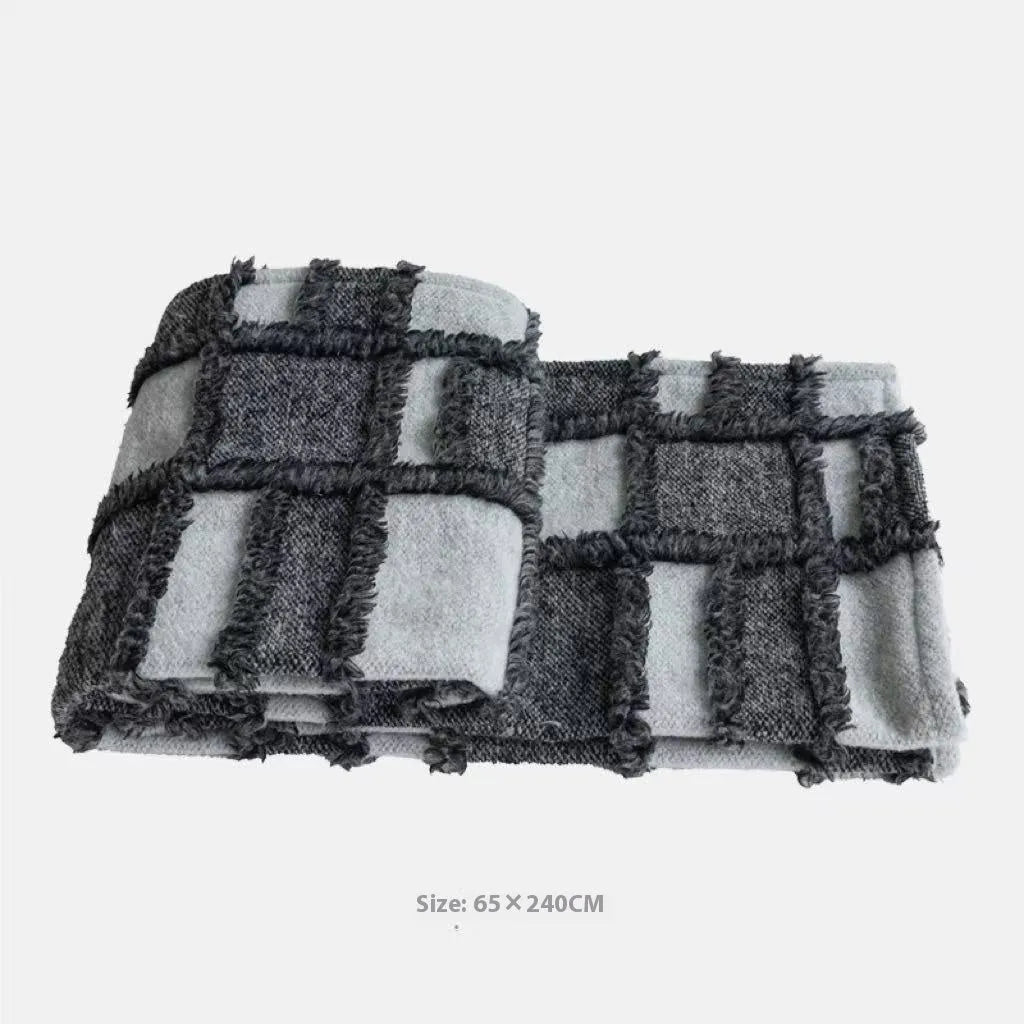 Modern minimalist grey and white plaid bed runner blanket set with pillow on bed