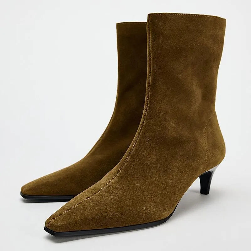 Brown women's square toe ankle boots with a side zipper and a mid kitten heel on a white background.