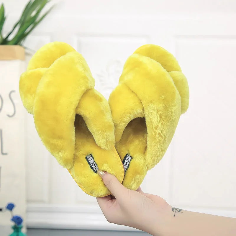 Cross open-toe fur slippers in various colours on a non-slip patterned rubber sole.