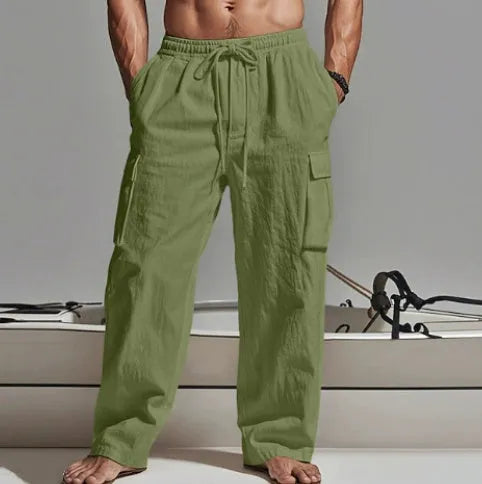 Man wearing loose-fitting, solid-colour cotton wide-leg casual trousers.