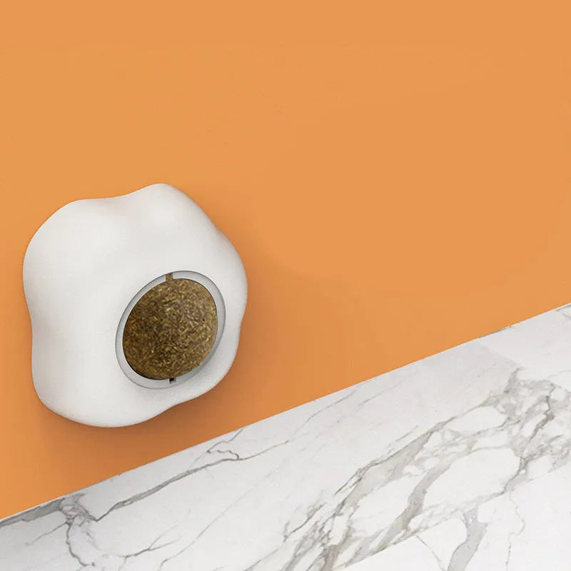 Catnip ball toy in fried egg and poached egg shapes with adhesive backing for wall mounting