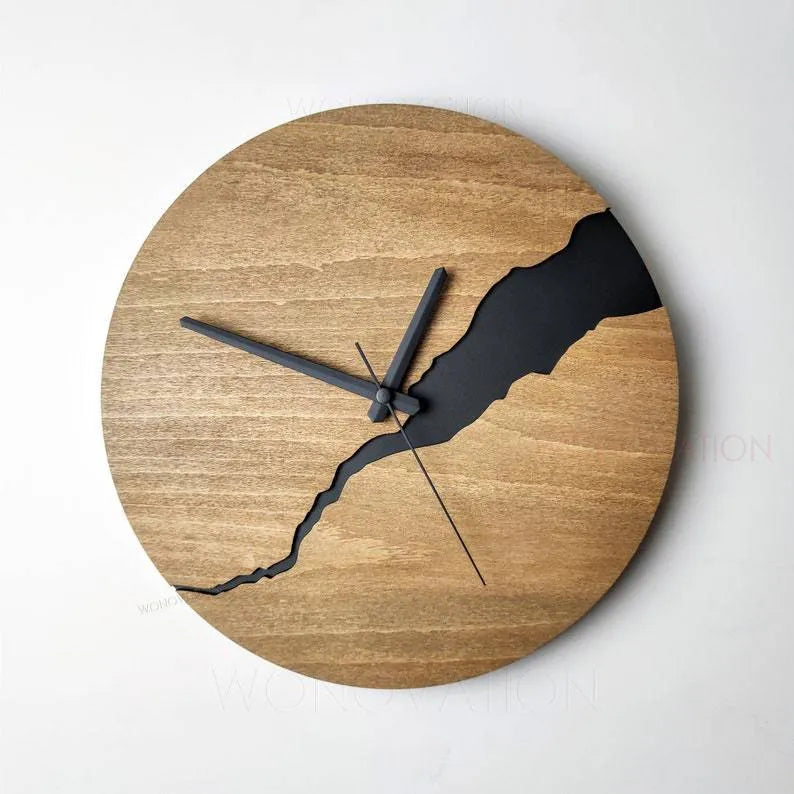 Modern wooden wall clock with cracked finish and Arabic numerals in contemporary home setting