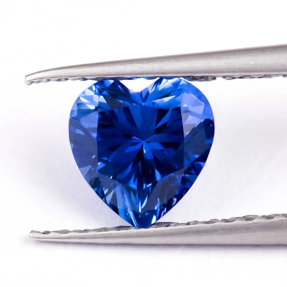 Royal blue love shaped tiara gemstones in various weights and shapes including heart, round, and pear styles