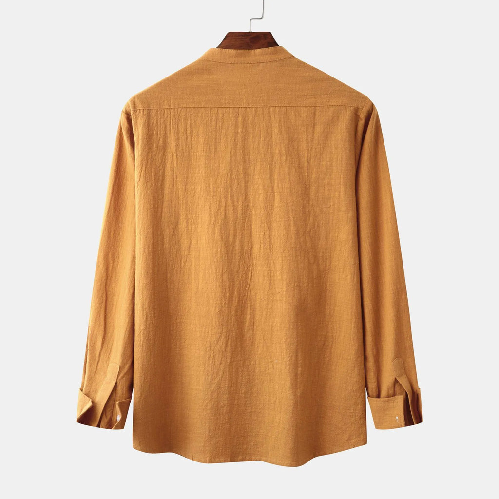 Brown men's slim fit long sleeve shirt and casual trousers set on a hanger.
