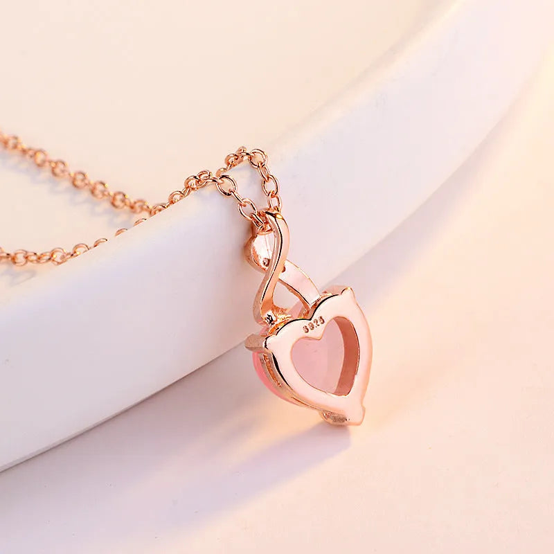 Rose gold electroplated heart-shaped crystal pendant necklace with cross chain design