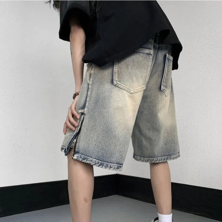 Blue wide-leg denim shorts with tattered retro styling and loose fit design