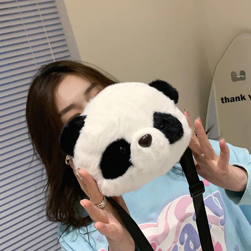 Soft plush cylindrical crossbody bag with panda head design, showing sandwich pocket.