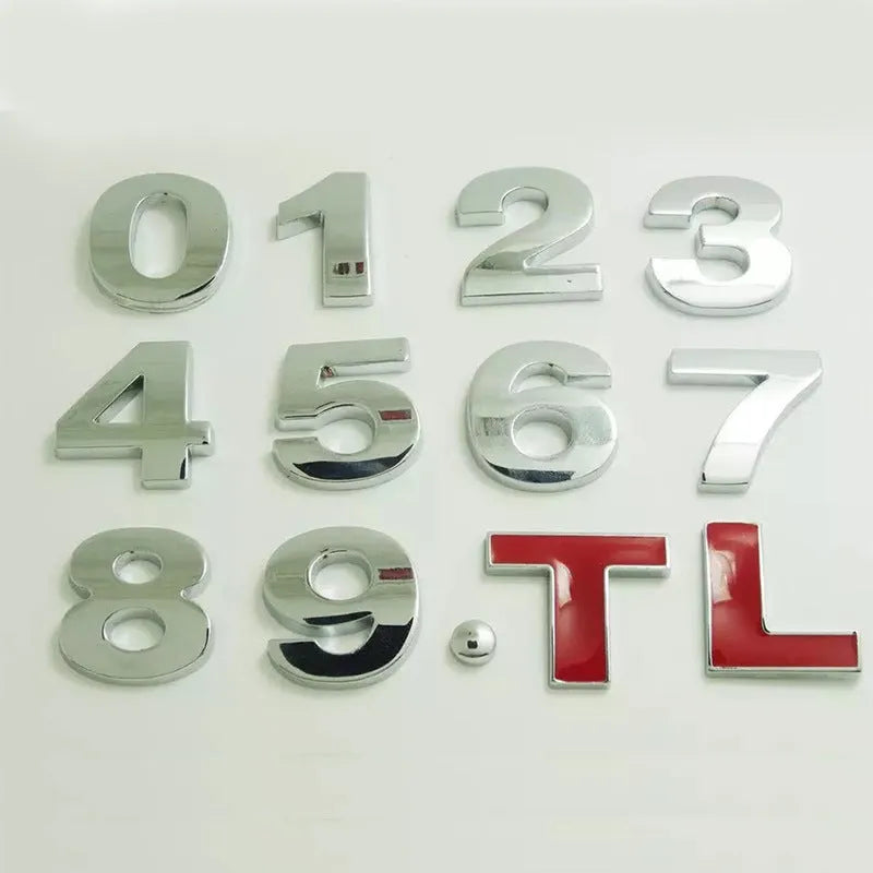 Close-up of a silver zinc alloy 3D raised letter 'A' car bumper sticker, approx 2.5cm tall.