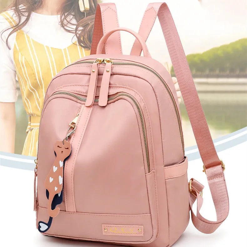 Women's black waterproof casual backpack with double shoulder straps and internal organisation compartments