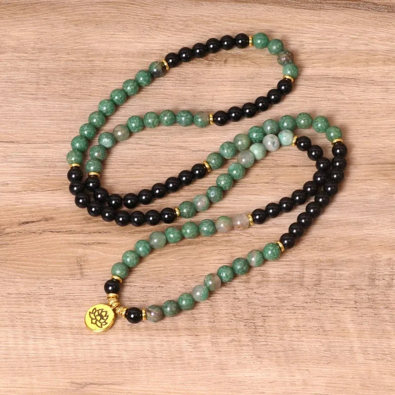 Green and black elastic beaded long bracelet with alloy components