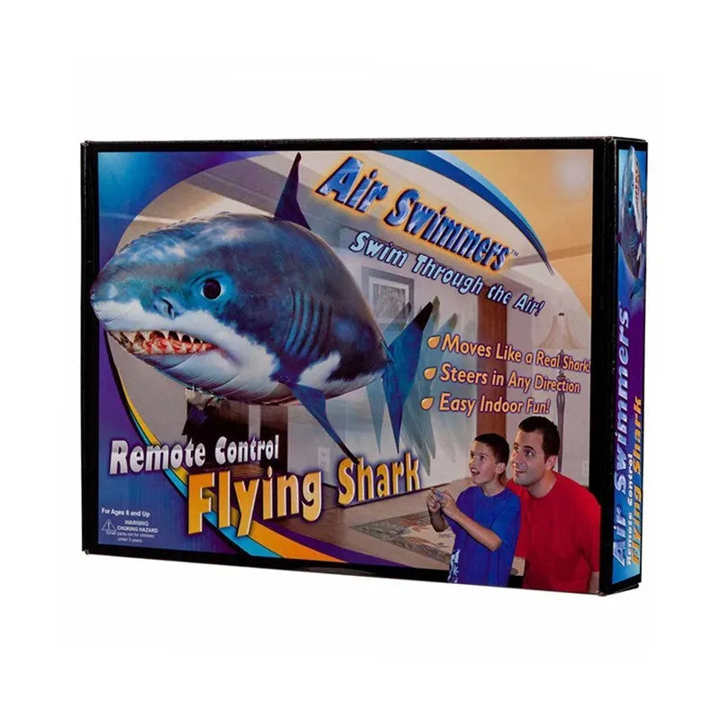 Large remote control inflatable shark balloon floating indoors with remote.