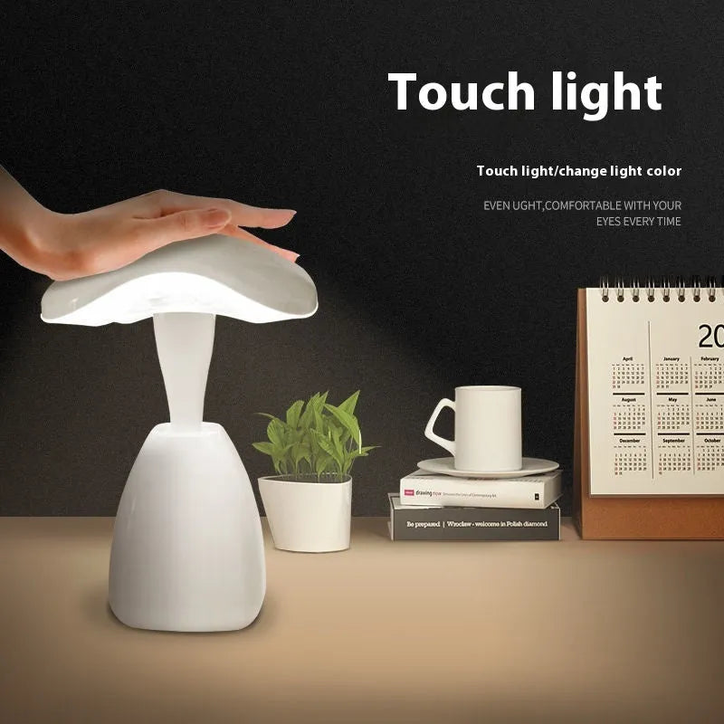 White modern LED desk lamp with plastic shade and touch controls for bedside or desk use