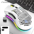 Wireless gaming mouse with hollow-out shell showing RGB lighting through openings