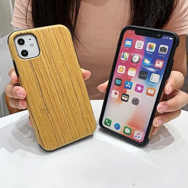 Natural wood grain iPhone back cover case in rosewood finish next to an iPhone