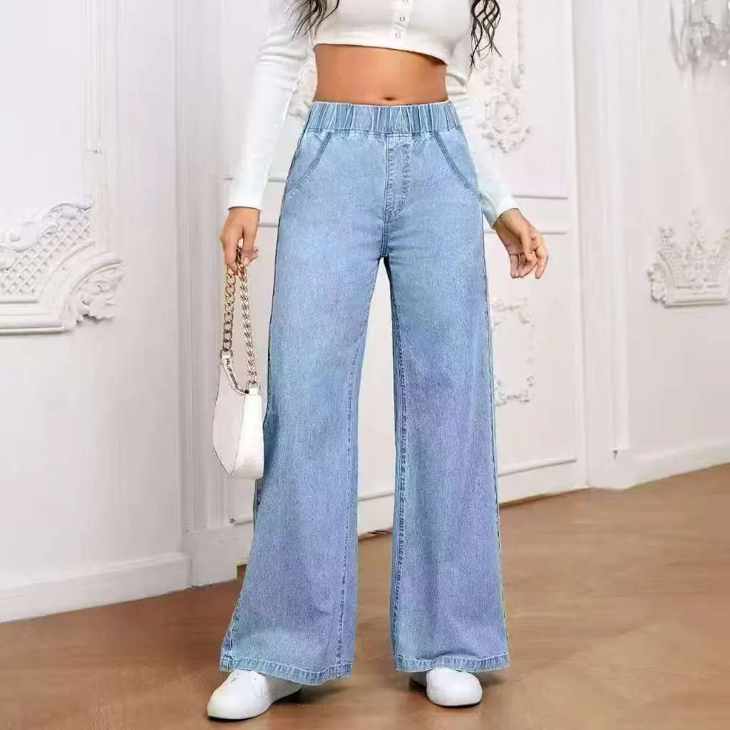 Light blue washed wide-leg denim trousers on a hanger, showing straight cut and zip front.