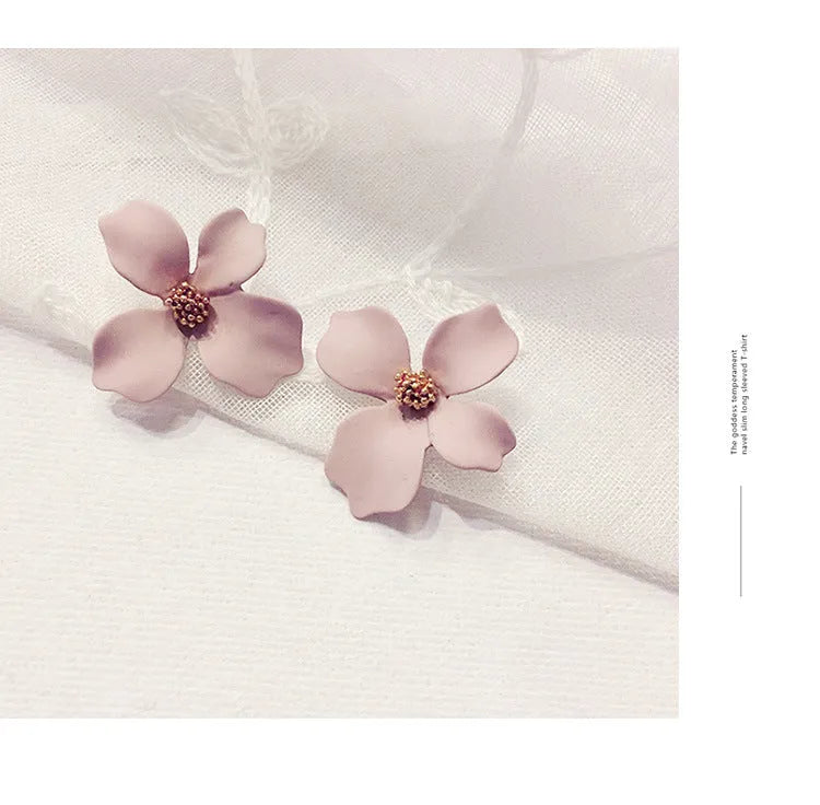 Flower shape stud earrings in pink and white colours with electroplated finish