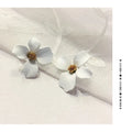 Flower shape stud earrings in pink and white colours with electroplated finish
