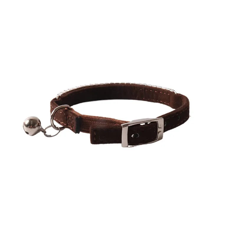 Soft flocking fabric cat collar with elastic buckle and gang drill in multiple colours.