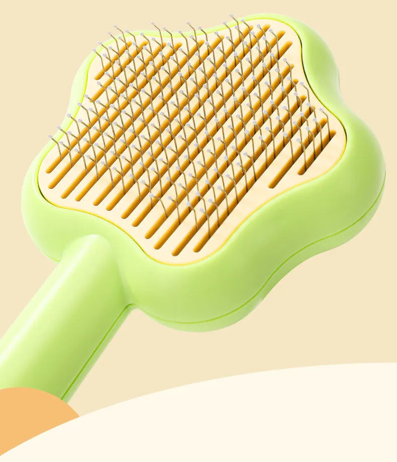 Self-cleaning stainless steel cat comb in green colour measuring 20cm long by 9.5cm wide