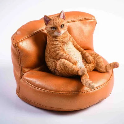 Lazy cat ornament and fabric sofa model set for car dashboard, 7.5cm high.