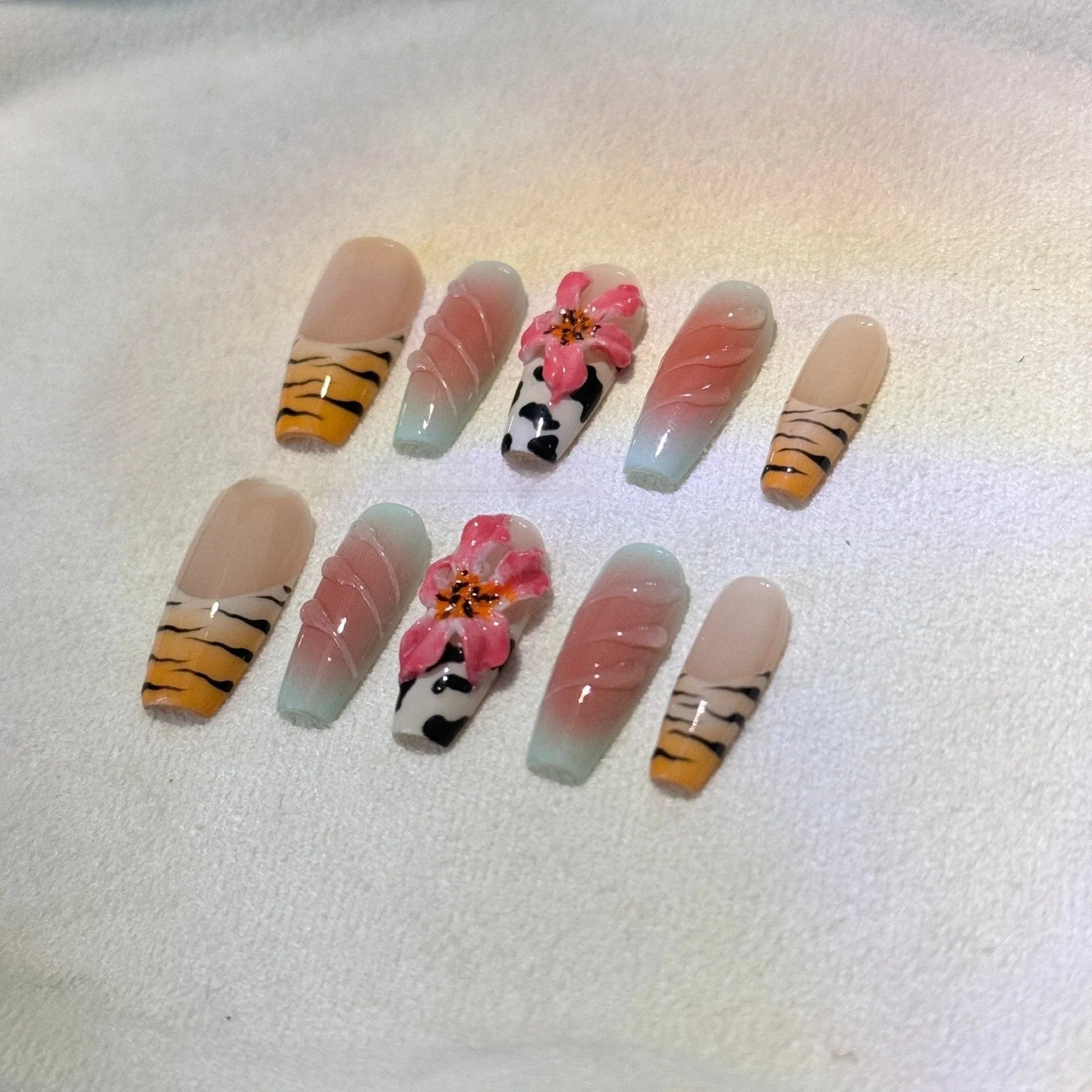 Hand-carved zebra pattern and lily floral nail art set with embossed leopard print.