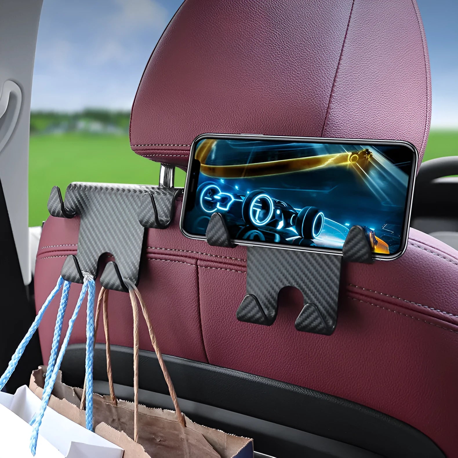 Black ABS plastic car multifunction hook bracket with integrated mobile phone holder for rear seat mounting.