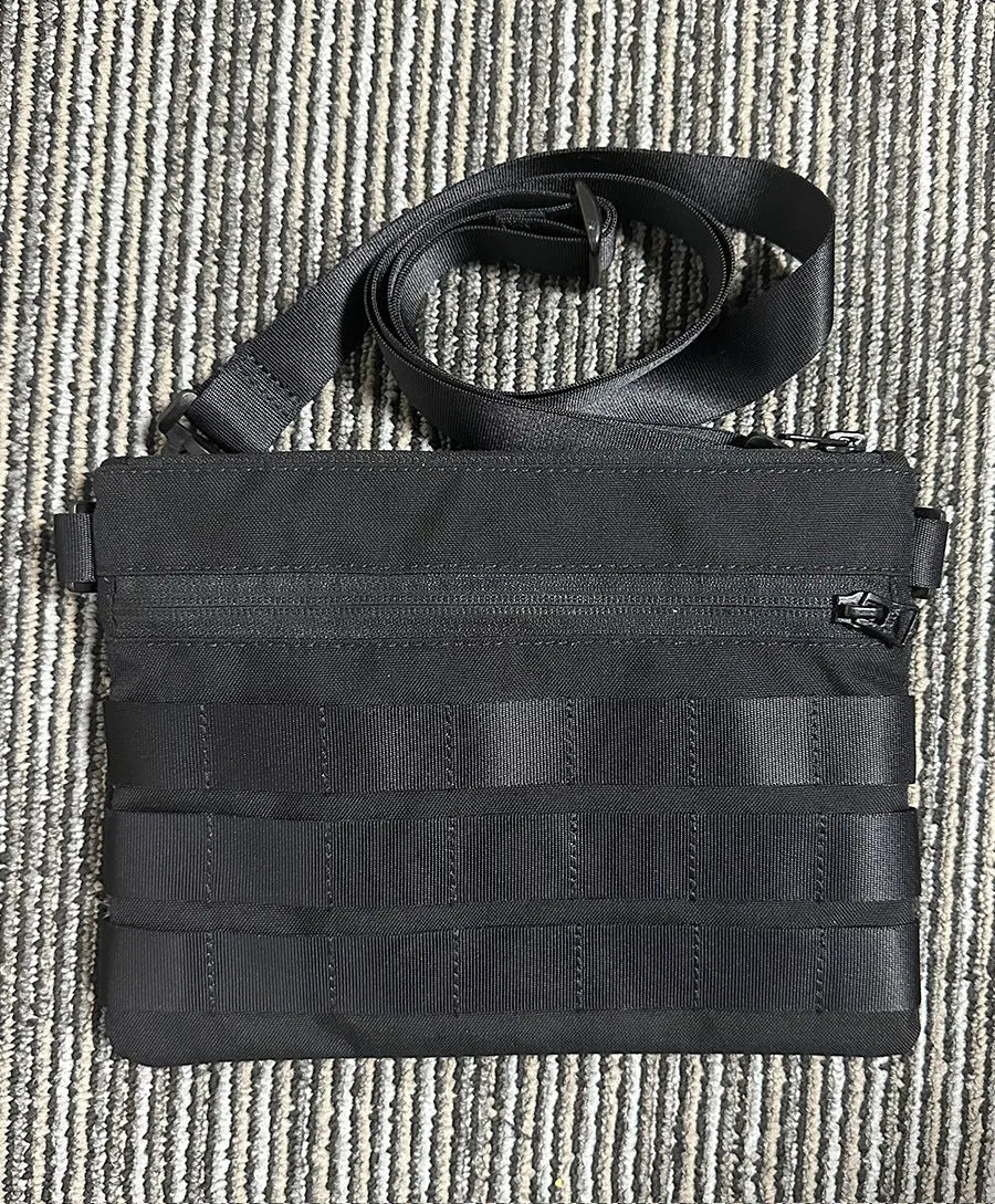 Black Oxford cloth outdoor organiser pouch with compact size for gear organisation.