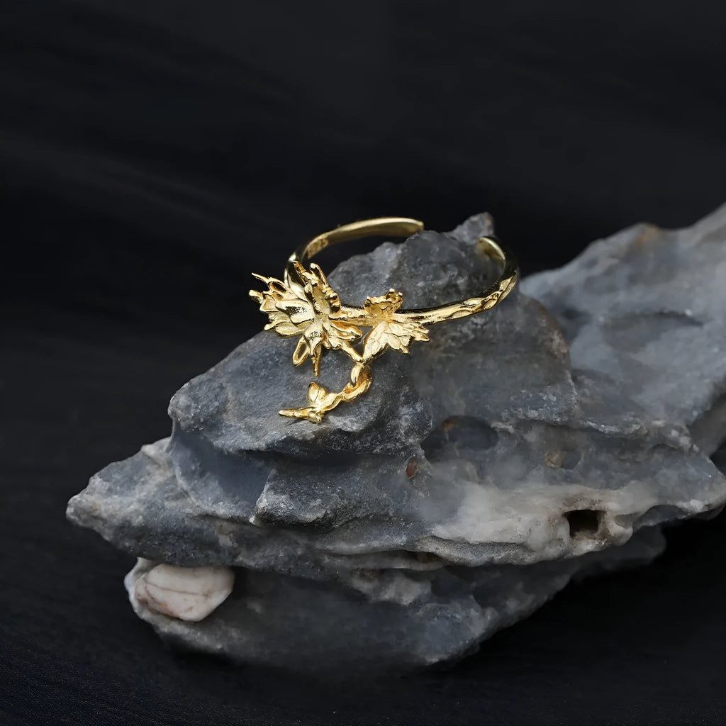 Silver butterfly ring with adjustable opening in white gold or 18K gold colour tone.