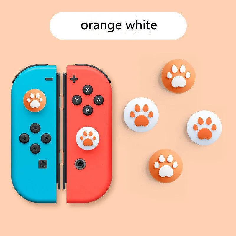 Four silicone rocker caps for Nintendo Switch Joy-Con controllers in assorted colours on a grey background.