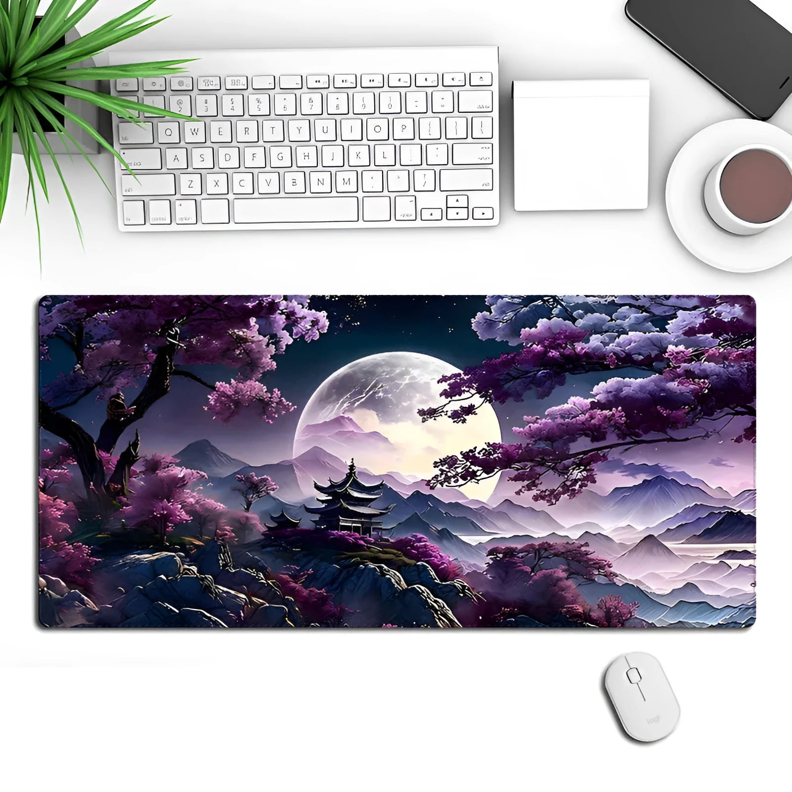 Large black gaming mouse pad with geometric pattern on a desk, shown with keyboard and mouse.