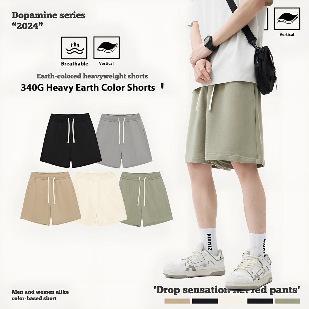Loose fit cotton denim baby shorts in charcoal grey on a hanger