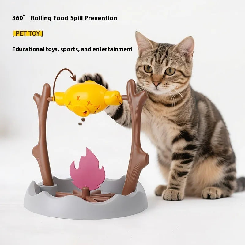 Barbecue-shaped plastic cat feeder toy for dispensing dry kibble during play.