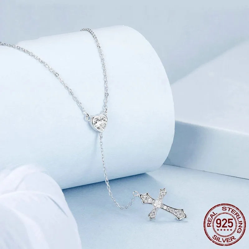 Silver love cross pendant necklace with V-neck chain on woman