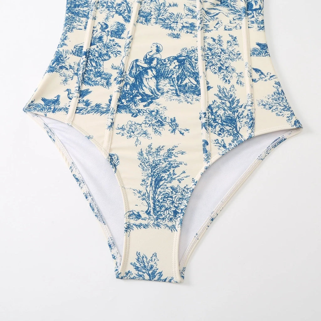 Blue patterned one-piece swimsuit for women shown with an optional matching gauze skirt.