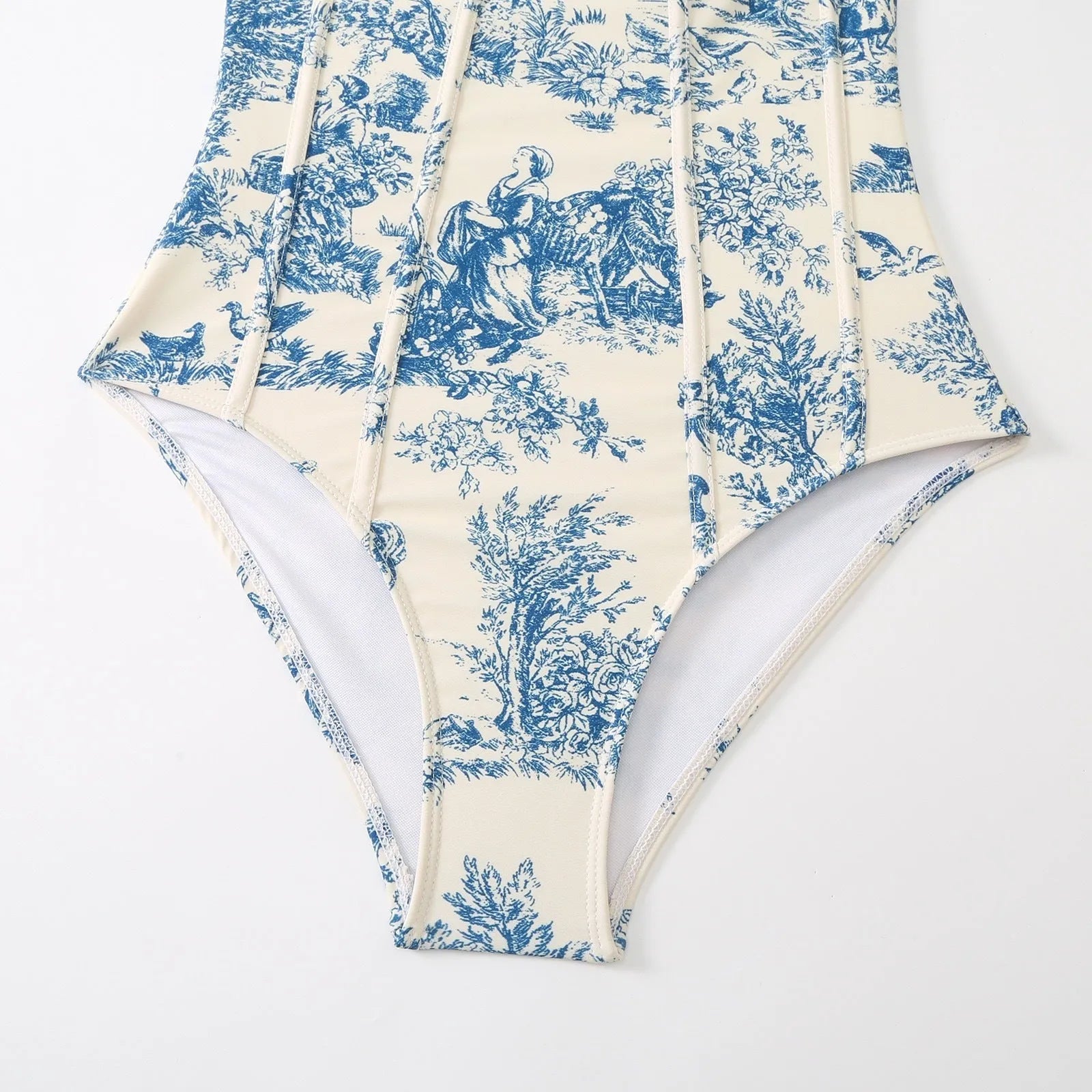 Blue patterned one-piece swimsuit for women shown with an optional matching gauze skirt.