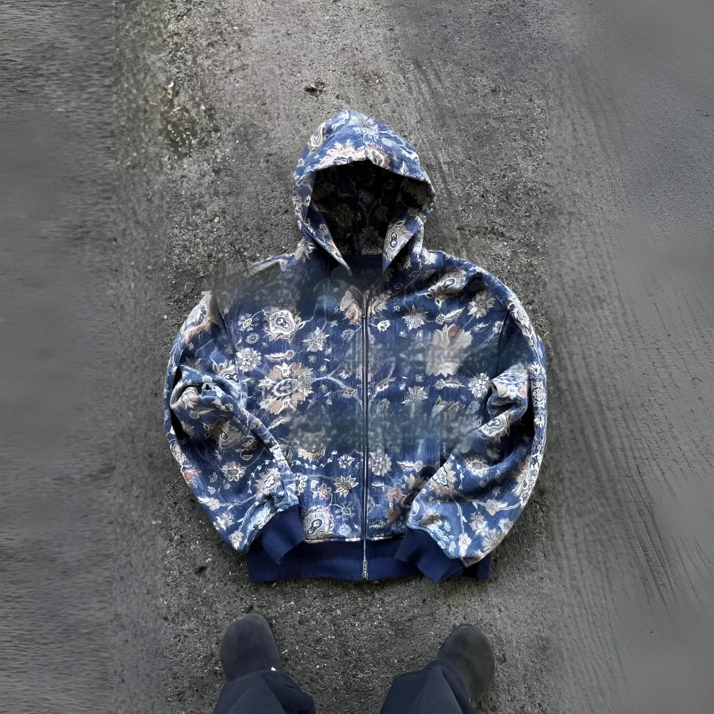 Man wearing a loose-fit blue hooded zip-up polyester coat for casual autumn wear.