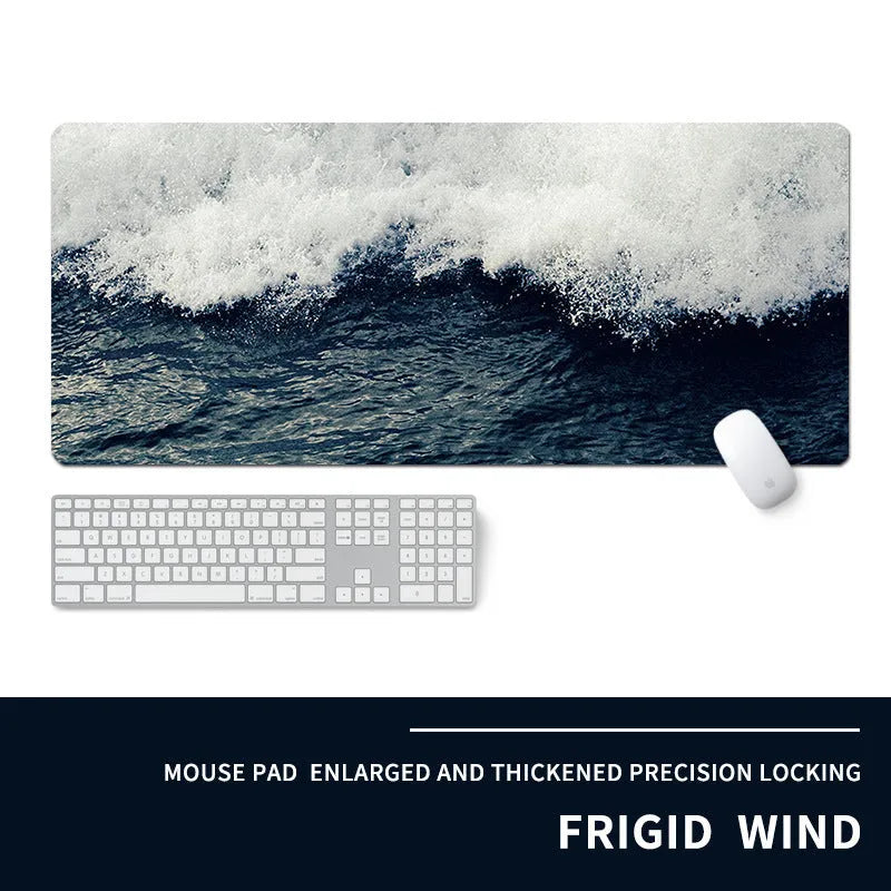 Oversized natural rubber gaming desk mat with graphical print, showing keyboard and mouse placement.