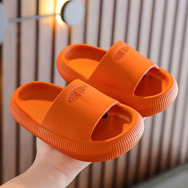 Children's mixed colour EVA slippers with non-slip soles showing size options from 15.5cm to 21.5cm