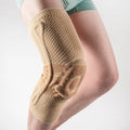 Adult sports kneepad in black and blue colours showing knee protection design