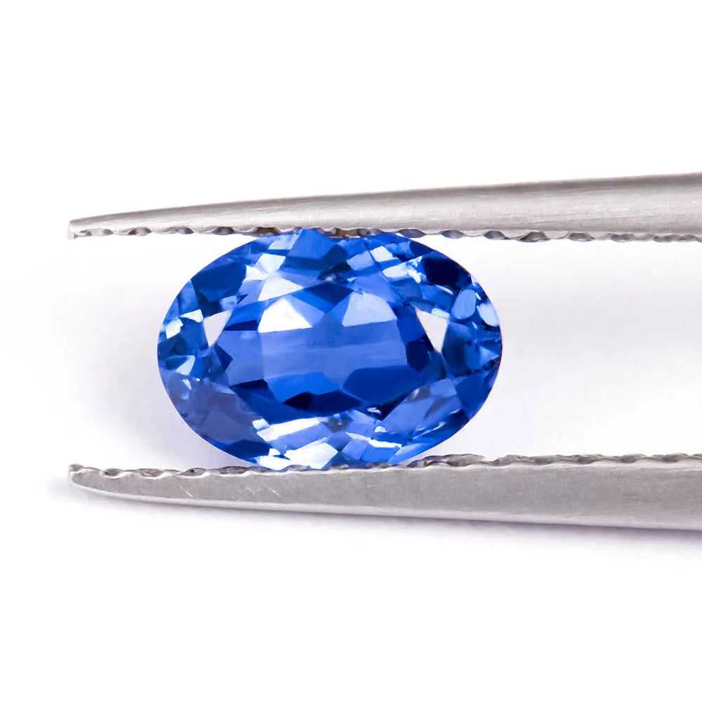 Royal blue love shaped tiara gemstones in various weights and shapes including heart, round, and pear styles