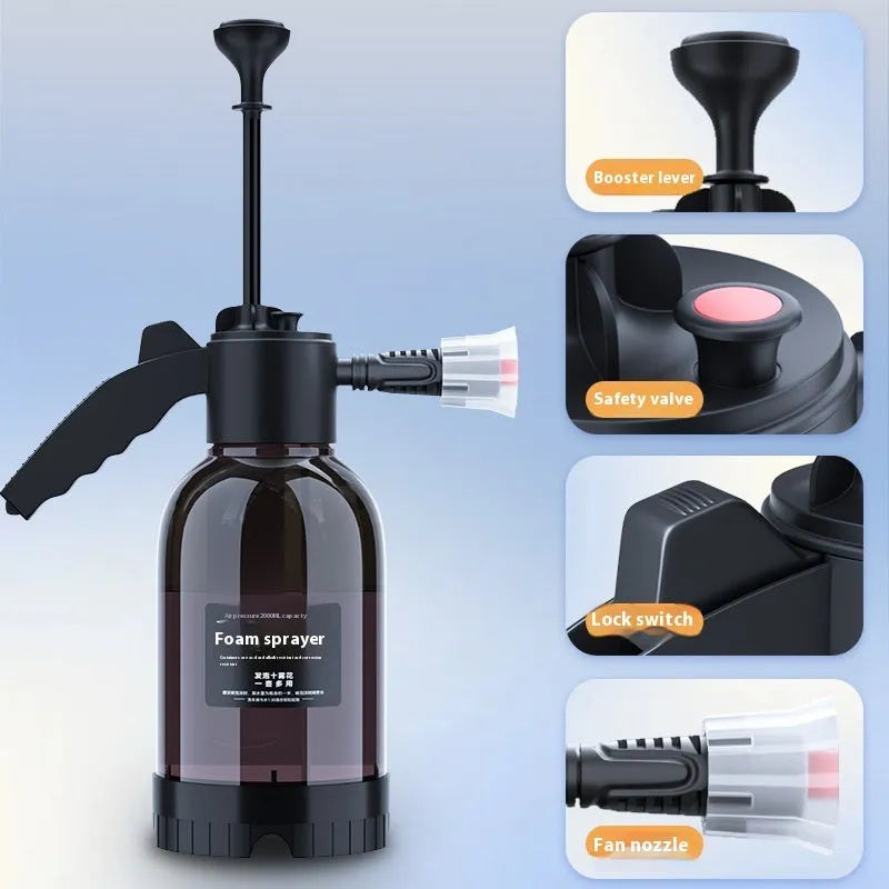 Black 2 litre handheld foam spray watering can with a comfortable handle and two nozzle attachments.