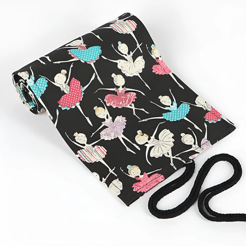 Square canvas rolling pencil case with ballet girl print, showing interior holes for storing pencils.