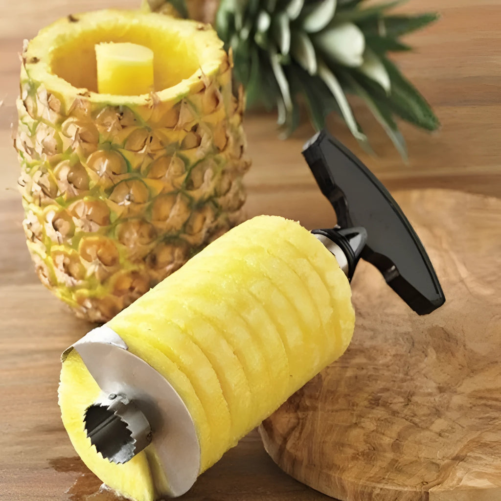 Stainless steel pineapple peeler with black handle and coring blade, 83.7 mm width, shown on white background