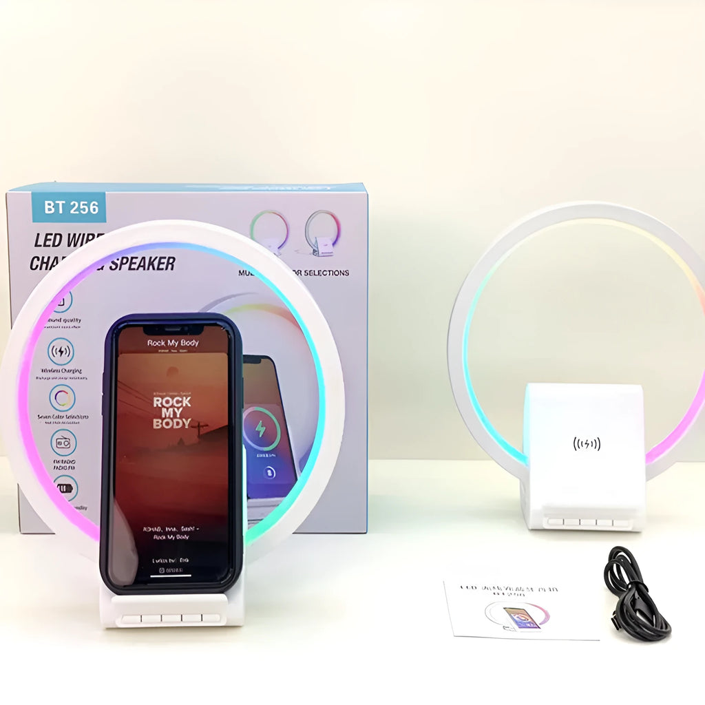 White rectangular Bluetooth speaker with wireless charging pad and ambient lighting