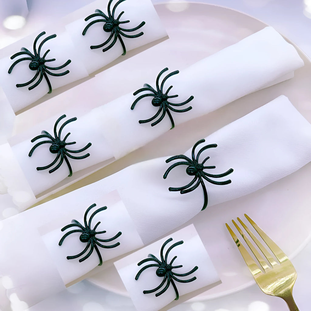 Set of six black alloy spider-shaped napkin rings for Halloween table decoration